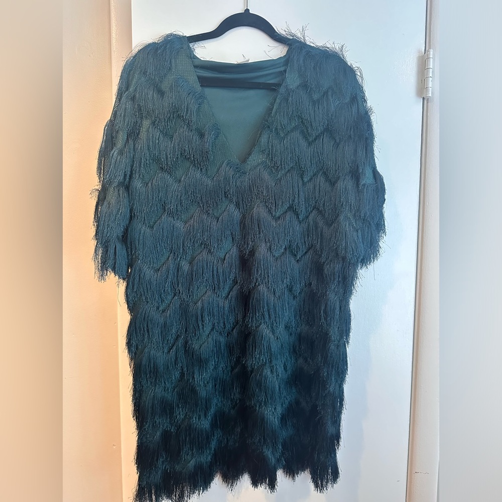 Emerald green flapper-style dress.